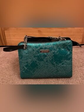 Miche Shoulder Bag comes with 4 shells featuring Chain Strap and Logo Plate
